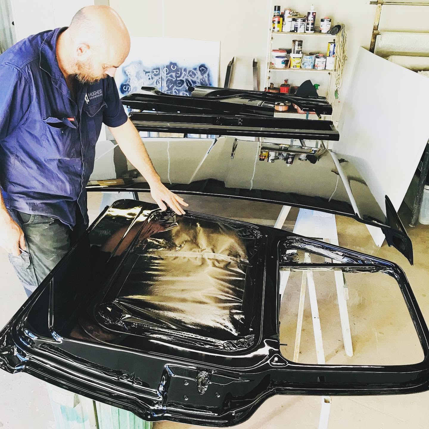 Nicholas Hughes welding marine boat roof in the shed at Nicholas Hughes Engineering Ballina
